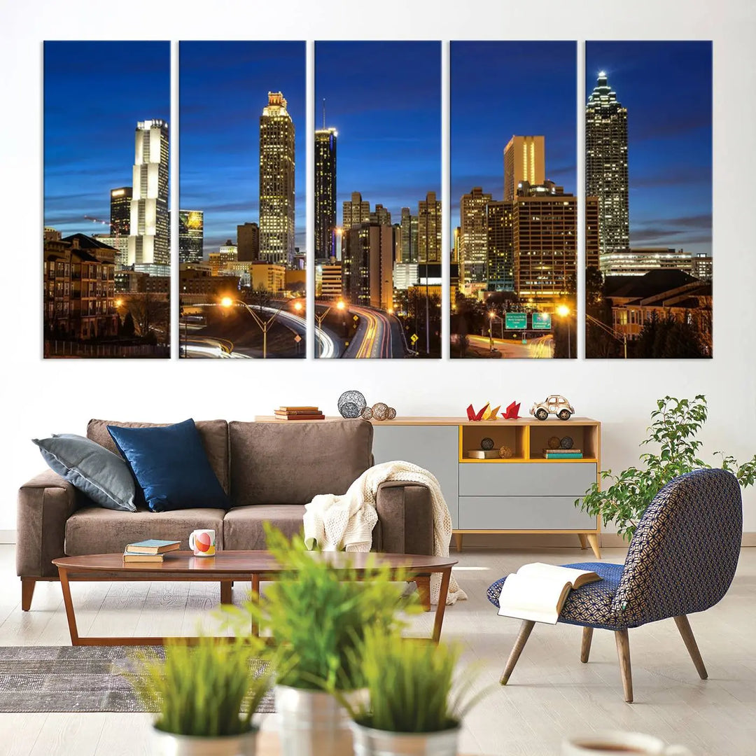 A modern living room is enhanced by the "Atlanta Cityscape View Wall Art Canvas Print" displayed as a triptych on museum-quality canvas. The hand-assembled framed art adds sophistication, crafting an inviting atmosphere. Complete your stylish space effortlessly with free shipping.