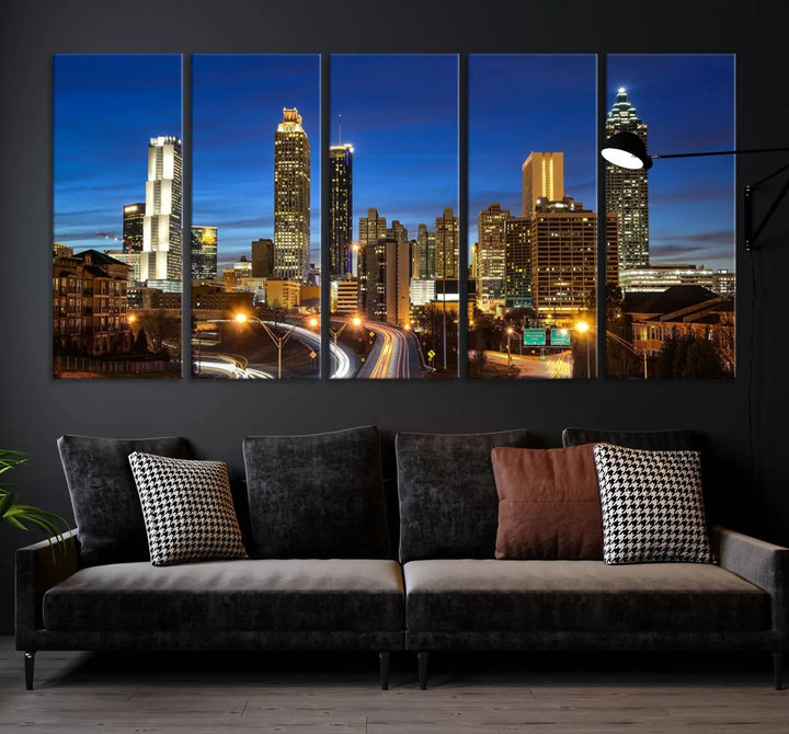 A modern living room is enhanced by the "Atlanta Cityscape View Wall Art Canvas Print" displayed as a triptych on museum-quality canvas. The hand-assembled framed art adds sophistication, crafting an inviting atmosphere. Complete your stylish space effortlessly with free shipping.