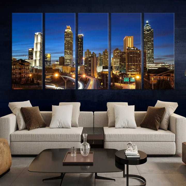 A modern living room is enhanced by the "Atlanta Cityscape View Wall Art Canvas Print" displayed as a triptych on museum-quality canvas. The hand-assembled framed art adds sophistication, crafting an inviting atmosphere. Complete your stylish space effortlessly with free shipping.