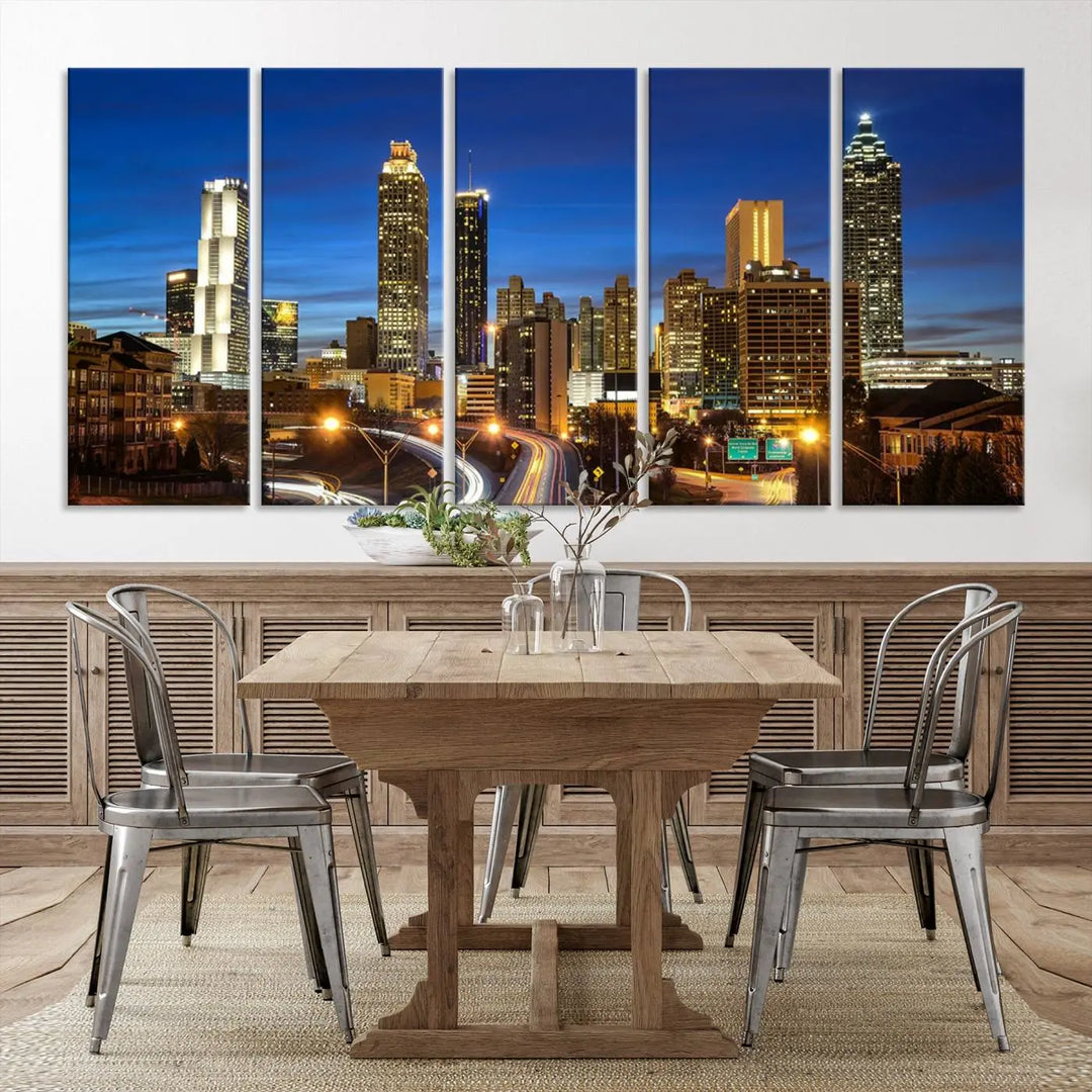 A modern living room is enhanced by the "Atlanta Cityscape View Wall Art Canvas Print" displayed as a triptych on museum-quality canvas. The hand-assembled framed art adds sophistication, crafting an inviting atmosphere. Complete your stylish space effortlessly with free shipping.