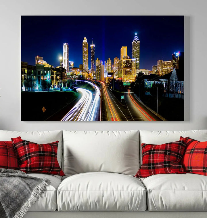 The "Atlanta Highways City View Wall Art Canvas Print" features a stunning triptych of a city skyline at night, crafted with museum-quality canvas. It comes ready to hang for an effortless addition to your decor.