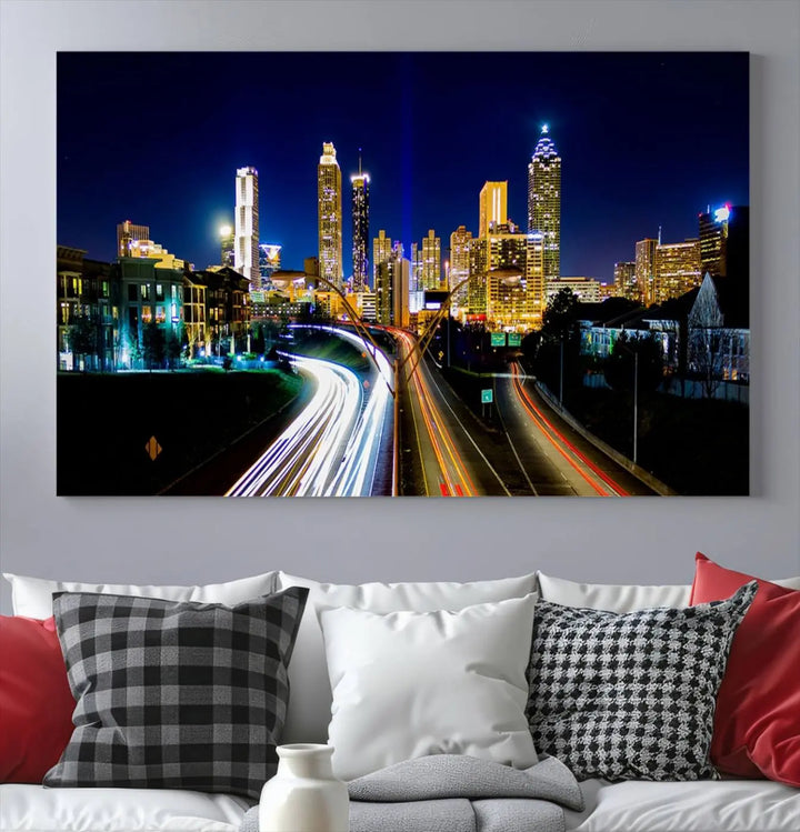 The "Atlanta Highways City View Wall Art Canvas Print" features a stunning triptych of a city skyline at night, crafted with museum-quality canvas. It comes ready to hang for an effortless addition to your decor.