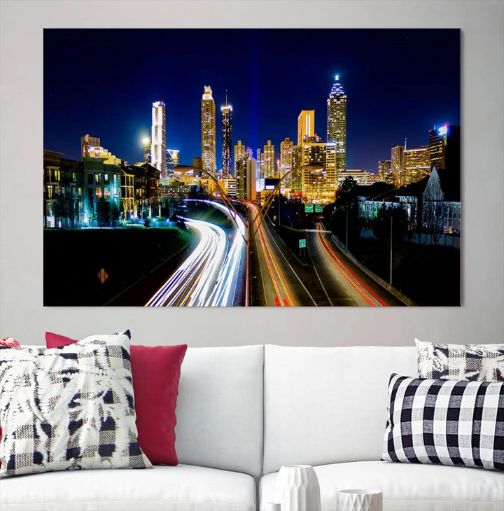 The "Atlanta Highways City View Wall Art Canvas Print" features a stunning triptych of a city skyline at night, crafted with museum-quality canvas. It comes ready to hang for an effortless addition to your decor.