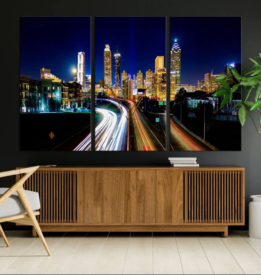 The "Atlanta Highways City View Wall Art Canvas Print" features a stunning triptych of a city skyline at night, crafted with museum-quality canvas. It comes ready to hang for an effortless addition to your decor.