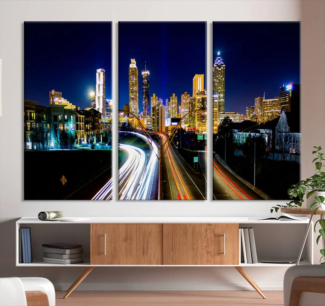 The "Atlanta Highways City View Wall Art Canvas Print" features a stunning triptych of a city skyline at night, crafted with museum-quality canvas. It comes ready to hang for an effortless addition to your decor.