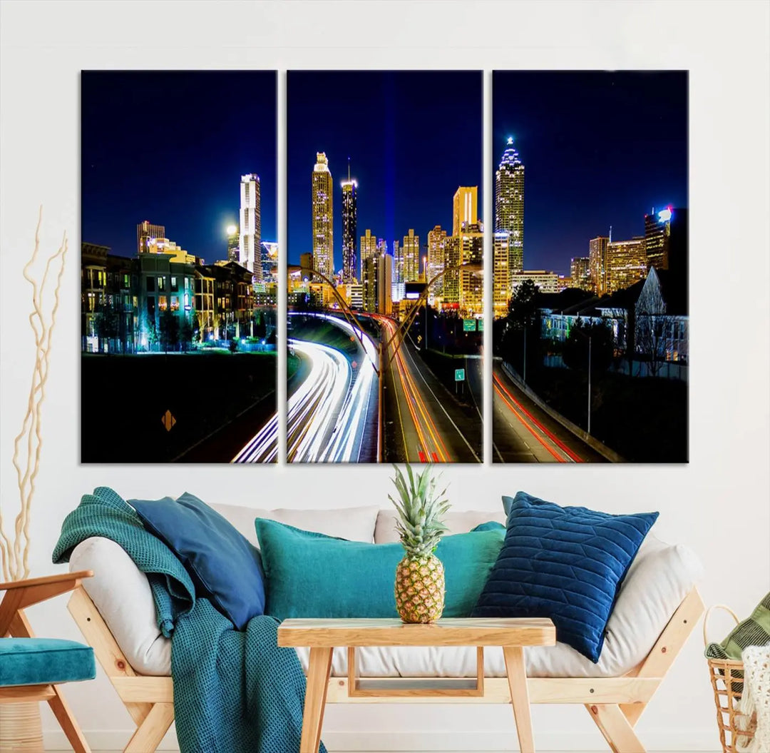 The "Atlanta Highways City View Wall Art Canvas Print" features a stunning triptych of a city skyline at night, crafted with museum-quality canvas. It comes ready to hang for an effortless addition to your decor.