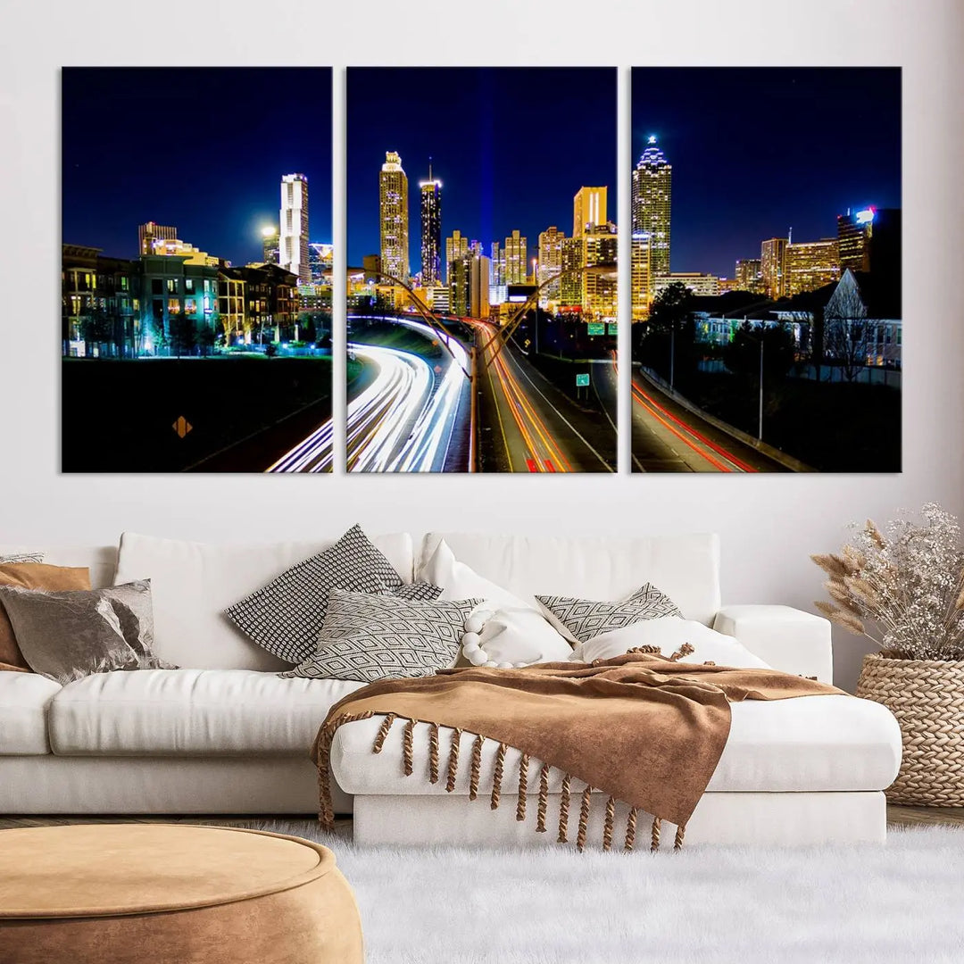 The "Atlanta Highways City View Wall Art Canvas Print" features a stunning triptych of a city skyline at night, crafted with museum-quality canvas. It comes ready to hang for an effortless addition to your decor.