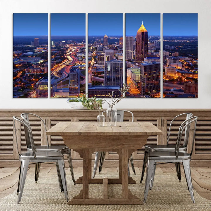 The triptych titled "Atlanta Wall Art Canvas Print" decorates the wall in a modern living room. This museum-quality artwork of a cityscape at night is ready to hang and features a UV-protective coating that ensures lasting vibrancy and elegance.