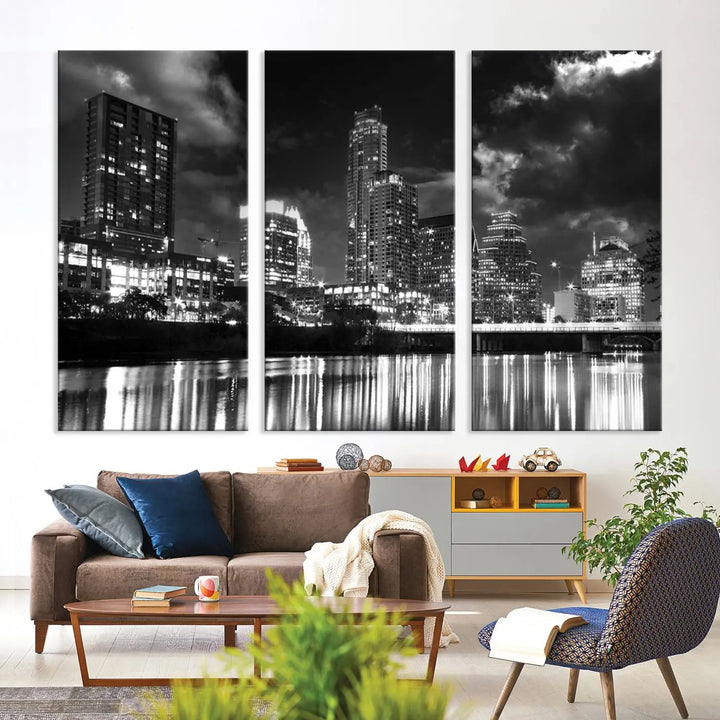 The Austin City Lights Cloudy Skyline Black and White Wall Art Cityscape Canvas Print is a large triptych that showcases illuminated city buildings reflected in water at night. This artwork is produced on museum-quality canvases with a UV-protective coating, ensuring its vibrancy and longevity for years to come.