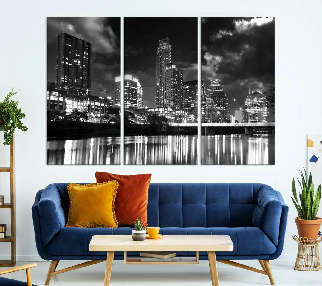 The Austin City Lights Cloudy Skyline Black and White Wall Art Cityscape Canvas Print is a large triptych that showcases illuminated city buildings reflected in water at night. This artwork is produced on museum-quality canvases with a UV-protective coating, ensuring its vibrancy and longevity for years to come.