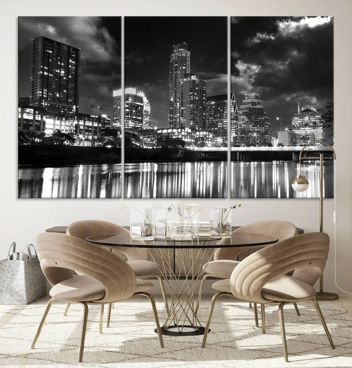 The Austin City Lights Cloudy Skyline Black and White Wall Art Cityscape Canvas Print is a large triptych that showcases illuminated city buildings reflected in water at night. This artwork is produced on museum-quality canvases with a UV-protective coating, ensuring its vibrancy and longevity for years to come.