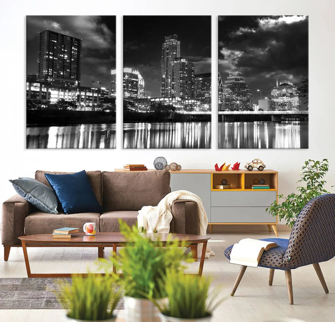 The Austin City Lights Cloudy Skyline Black and White Wall Art Cityscape Canvas Print is a large triptych that showcases illuminated city buildings reflected in water at night. This artwork is produced on museum-quality canvases with a UV-protective coating, ensuring its vibrancy and longevity for years to come.