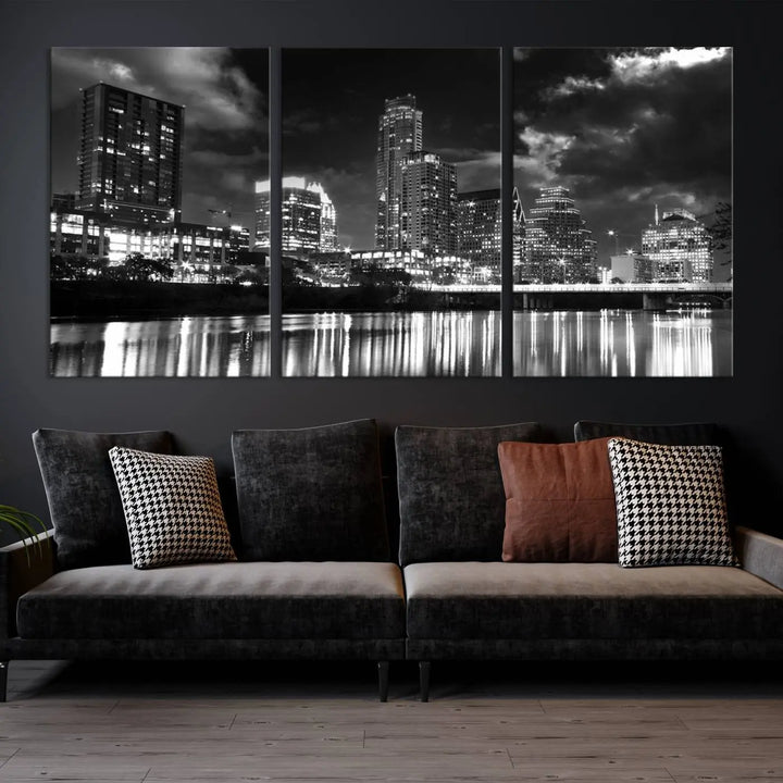 The Austin City Lights Cloudy Skyline Black and White Wall Art Cityscape Canvas Print is a large triptych that showcases illuminated city buildings reflected in water at night. This artwork is produced on museum-quality canvases with a UV-protective coating, ensuring its vibrancy and longevity for years to come.