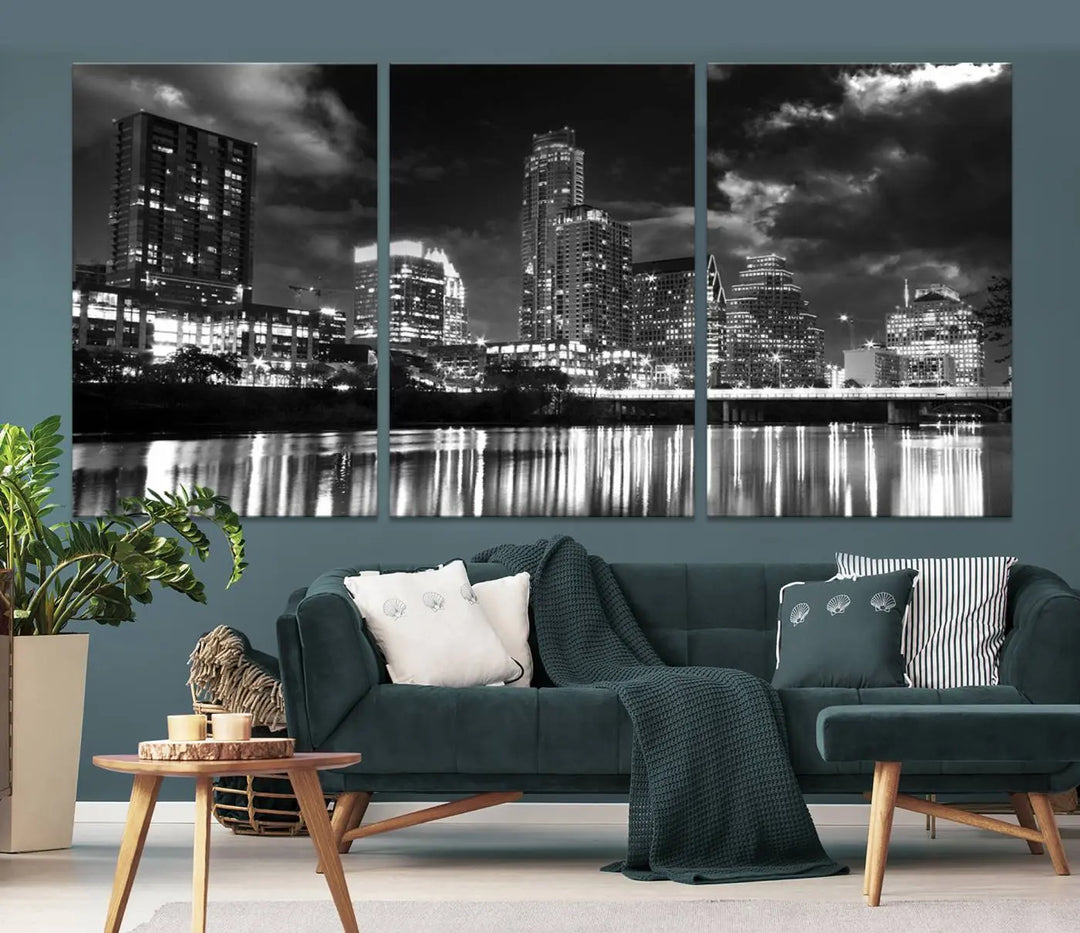 The Austin City Lights Cloudy Skyline Black and White Wall Art Cityscape Canvas Print is a large triptych that showcases illuminated city buildings reflected in water at night. This artwork is produced on museum-quality canvases with a UV-protective coating, ensuring its vibrancy and longevity for years to come.