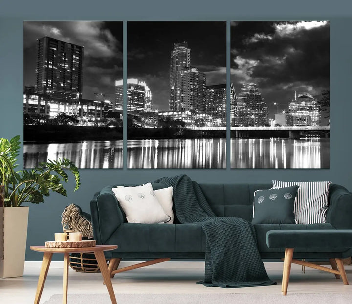 The Austin City Lights Cloudy Skyline Black and White Wall Art Cityscape Canvas Print is a large triptych that showcases illuminated city buildings reflected in water at night. This artwork is produced on museum-quality canvases with a UV-protective coating, ensuring its vibrancy and longevity for years to come.