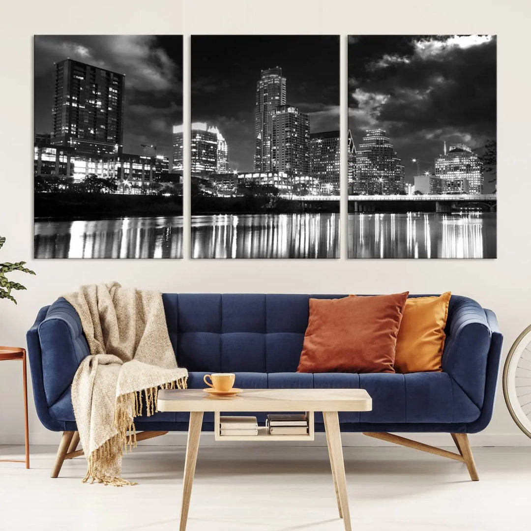 The Austin City Lights Cloudy Skyline Black and White Wall Art Cityscape Canvas Print is a large triptych that showcases illuminated city buildings reflected in water at night. This artwork is produced on museum-quality canvases with a UV-protective coating, ensuring its vibrancy and longevity for years to come.