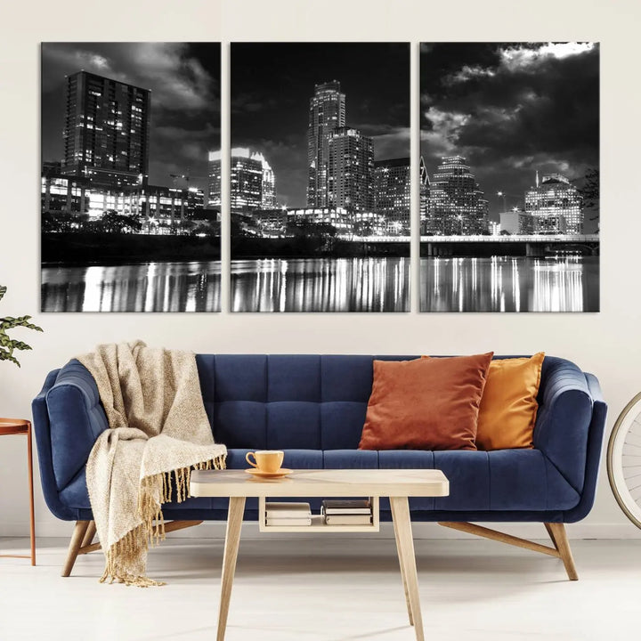 The Austin City Lights Cloudy Skyline Black and White Wall Art Cityscape Canvas Print is a large triptych that showcases illuminated city buildings reflected in water at night. This artwork is produced on museum-quality canvases with a UV-protective coating, ensuring its vibrancy and longevity for years to come.