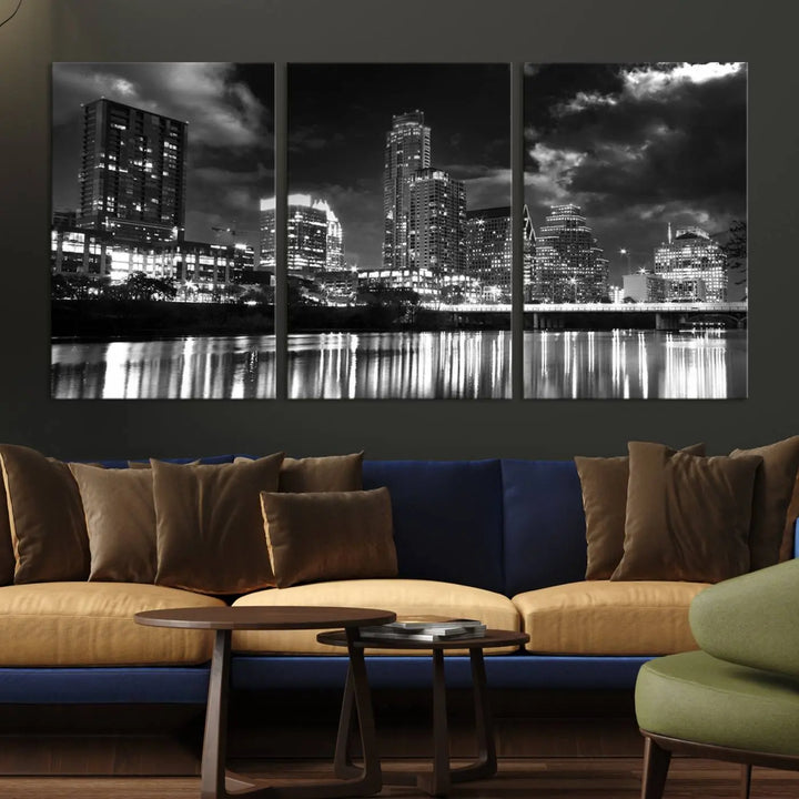 The Austin City Lights Cloudy Skyline Black and White Wall Art Cityscape Canvas Print is a large triptych that showcases illuminated city buildings reflected in water at night. This artwork is produced on museum-quality canvases with a UV-protective coating, ensuring its vibrancy and longevity for years to come.