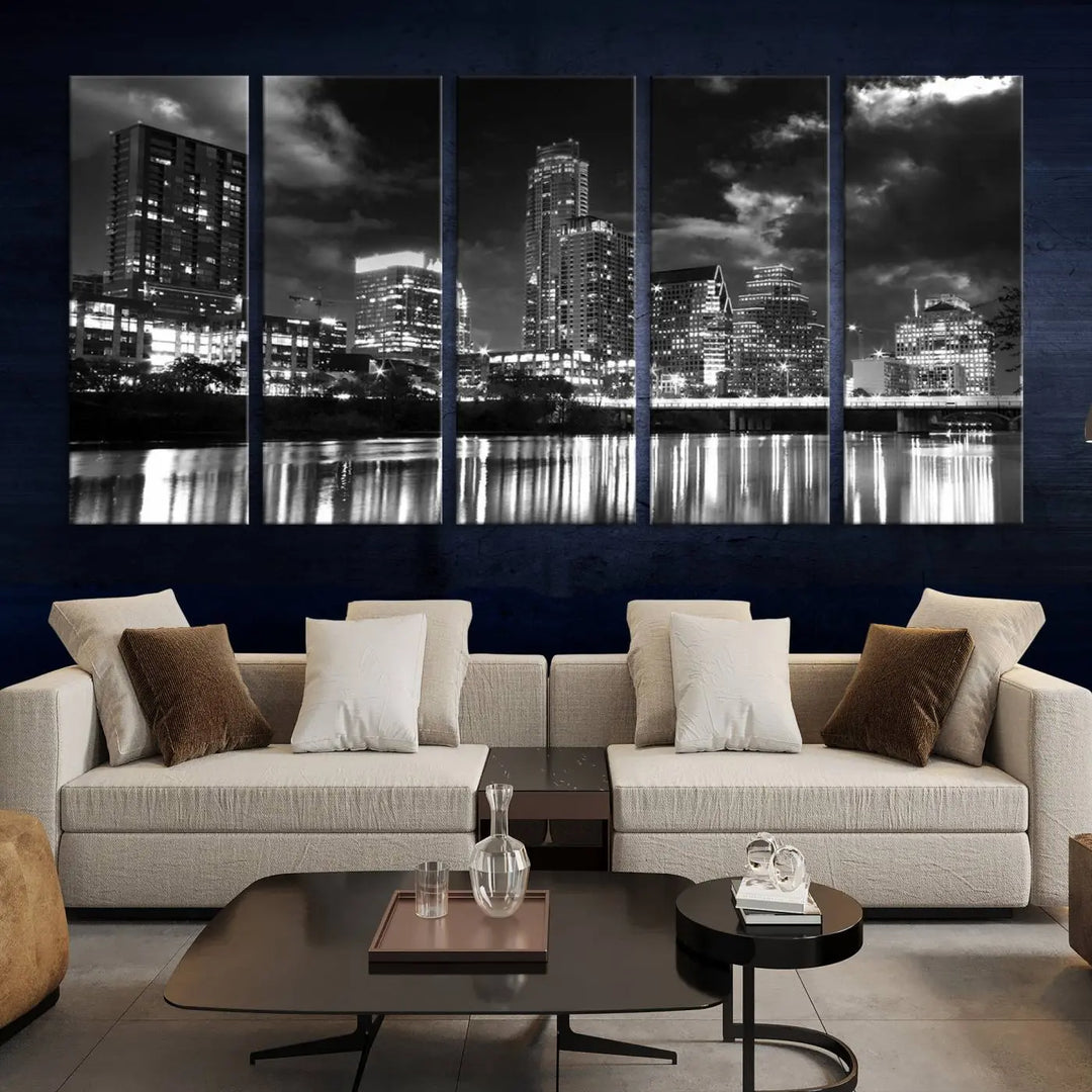 The Austin City Lights Cloudy Skyline Black and White Wall Art Cityscape Canvas Print is a large triptych that showcases illuminated city buildings reflected in water at night. This artwork is produced on museum-quality canvases with a UV-protective coating, ensuring its vibrancy and longevity for years to come.