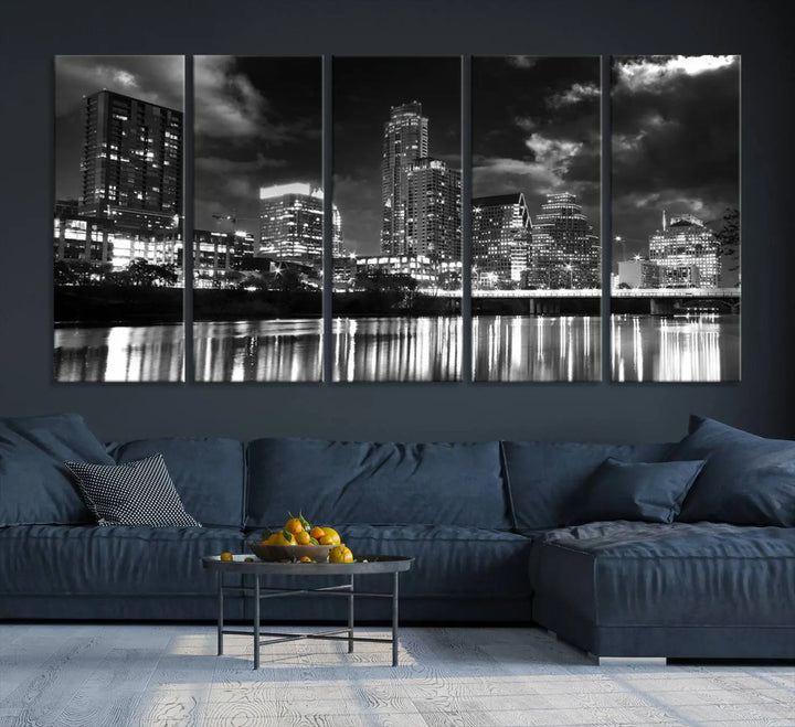 The Austin City Lights Cloudy Skyline Black and White Wall Art Cityscape Canvas Print is a large triptych that showcases illuminated city buildings reflected in water at night. This artwork is produced on museum-quality canvases with a UV-protective coating, ensuring its vibrancy and longevity for years to come.