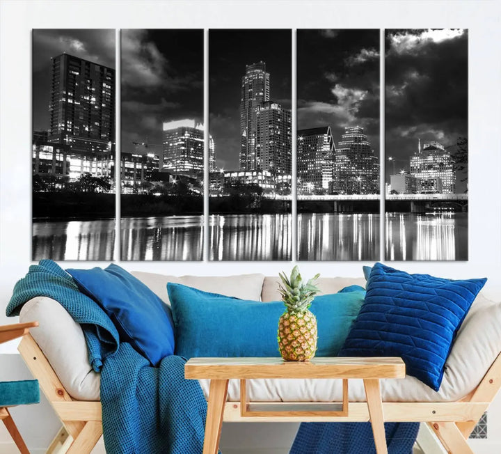 The Austin City Lights Cloudy Skyline Black and White Wall Art Cityscape Canvas Print is a large triptych that showcases illuminated city buildings reflected in water at night. This artwork is produced on museum-quality canvases with a UV-protective coating, ensuring its vibrancy and longevity for years to come.