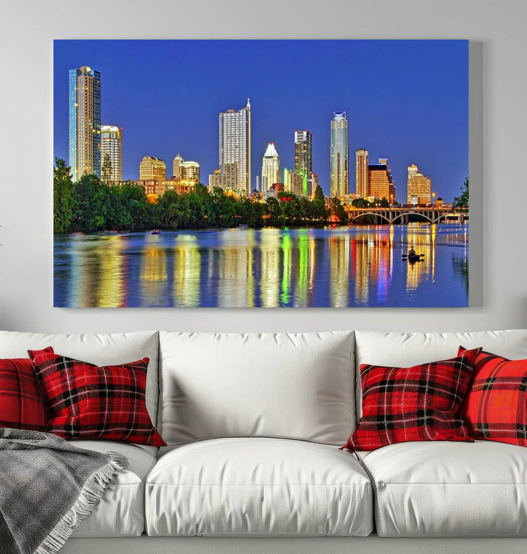 Austin City Lights Skyline Cityscape View Wall Art Canvas Print showcases a stunning triptych of a city skyline at night, featuring the reflection of illuminated buildings on a river. Made with museum-quality polycotton and finished with a UV-protective coating, it is ready to hang and instantly elevate your space.