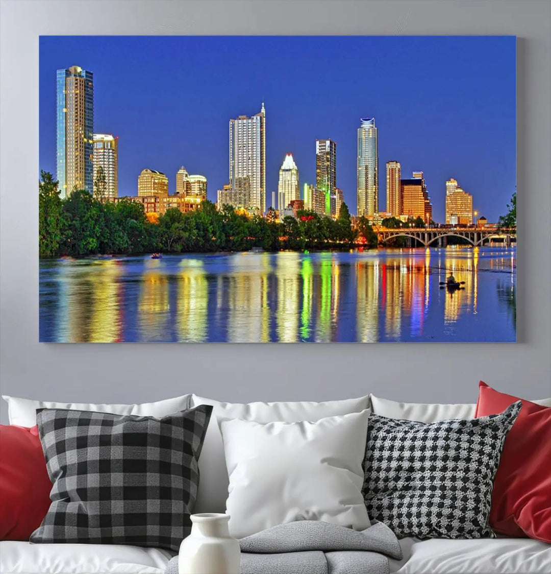 Austin City Lights Skyline Cityscape View Wall Art Canvas Print showcases a stunning triptych of a city skyline at night, featuring the reflection of illuminated buildings on a river. Made with museum-quality polycotton and finished with a UV-protective coating, it is ready to hang and instantly elevate your space.