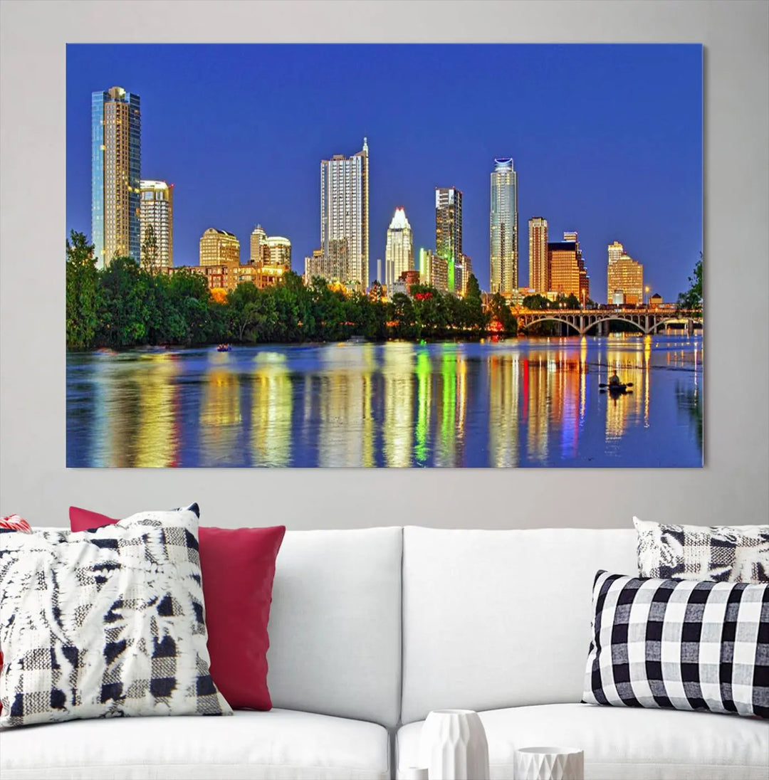 Austin City Lights Skyline Cityscape View Wall Art Canvas Print showcases a stunning triptych of a city skyline at night, featuring the reflection of illuminated buildings on a river. Made with museum-quality polycotton and finished with a UV-protective coating, it is ready to hang and instantly elevate your space.