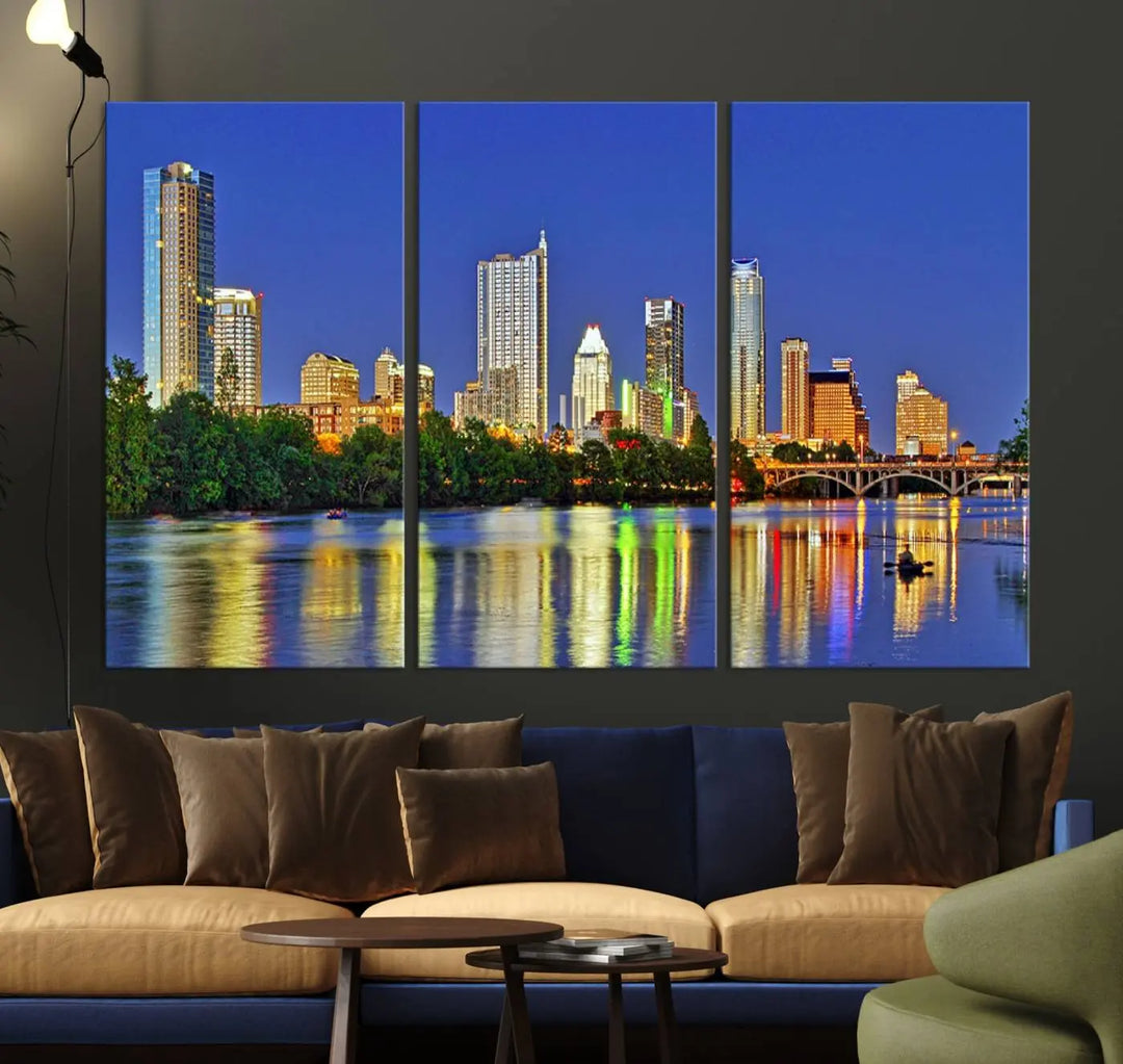 Austin City Lights Skyline Cityscape View Wall Art Canvas Print showcases a stunning triptych of a city skyline at night, featuring the reflection of illuminated buildings on a river. Made with museum-quality polycotton and finished with a UV-protective coating, it is ready to hang and instantly elevate your space.