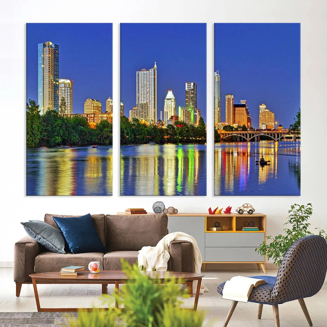 Austin City Lights Skyline Cityscape View Wall Art Canvas Print showcases a stunning triptych of a city skyline at night, featuring the reflection of illuminated buildings on a river. Made with museum-quality polycotton and finished with a UV-protective coating, it is ready to hang and instantly elevate your space.