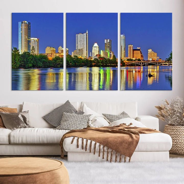 Austin City Lights Skyline Cityscape View Wall Art Canvas Print showcases a stunning triptych of a city skyline at night, featuring the reflection of illuminated buildings on a river. Made with museum-quality polycotton and finished with a UV-protective coating, it is ready to hang and instantly elevate your space.