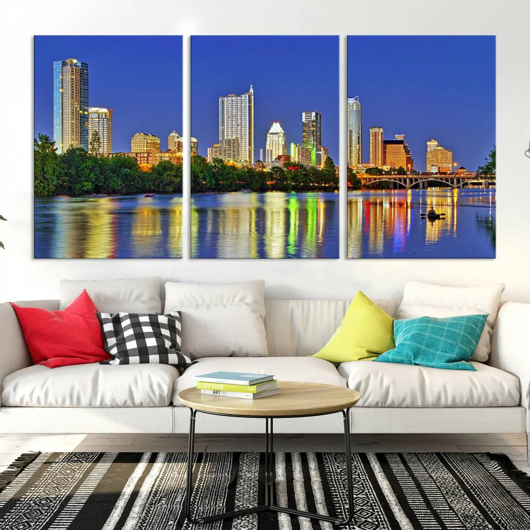 Austin City Lights Skyline Cityscape View Wall Art Canvas Print showcases a stunning triptych of a city skyline at night, featuring the reflection of illuminated buildings on a river. Made with museum-quality polycotton and finished with a UV-protective coating, it is ready to hang and instantly elevate your space.