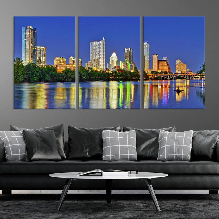 Austin City Lights Skyline Cityscape View Wall Art Canvas Print showcases a stunning triptych of a city skyline at night, featuring the reflection of illuminated buildings on a river. Made with museum-quality polycotton and finished with a UV-protective coating, it is ready to hang and instantly elevate your space.