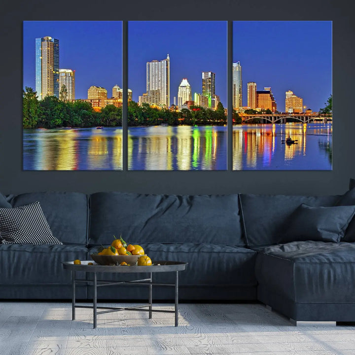 Austin City Lights Skyline Cityscape View Wall Art Canvas Print showcases a stunning triptych of a city skyline at night, featuring the reflection of illuminated buildings on a river. Made with museum-quality polycotton and finished with a UV-protective coating, it is ready to hang and instantly elevate your space.