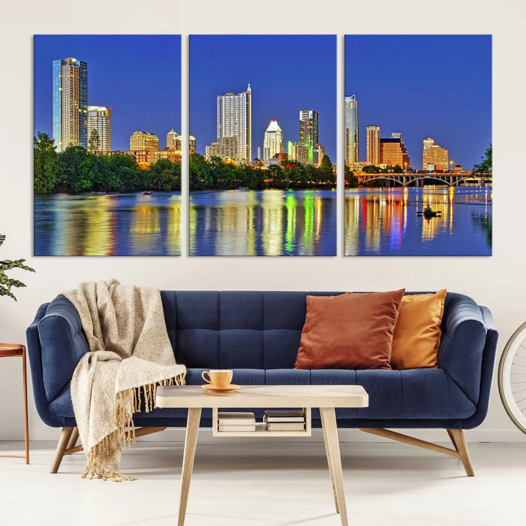 Austin City Lights Skyline Cityscape View Wall Art Canvas Print showcases a stunning triptych of a city skyline at night, featuring the reflection of illuminated buildings on a river. Made with museum-quality polycotton and finished with a UV-protective coating, it is ready to hang and instantly elevate your space.