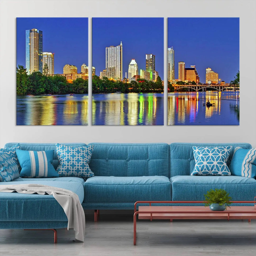 Austin City Lights Skyline Cityscape View Wall Art Canvas Print showcases a stunning triptych of a city skyline at night, featuring the reflection of illuminated buildings on a river. Made with museum-quality polycotton and finished with a UV-protective coating, it is ready to hang and instantly elevate your space.