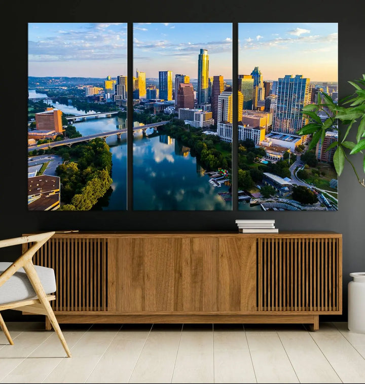 The Austin City Morning Sunrise Skyline Cityscape View Wall Art Canvas Print features a stunning view of a modern city skyline at sunrise, reflecting in a tranquil river. It is crafted on museum-quality canvas with UV-protective coating to ensure its lasting beauty.