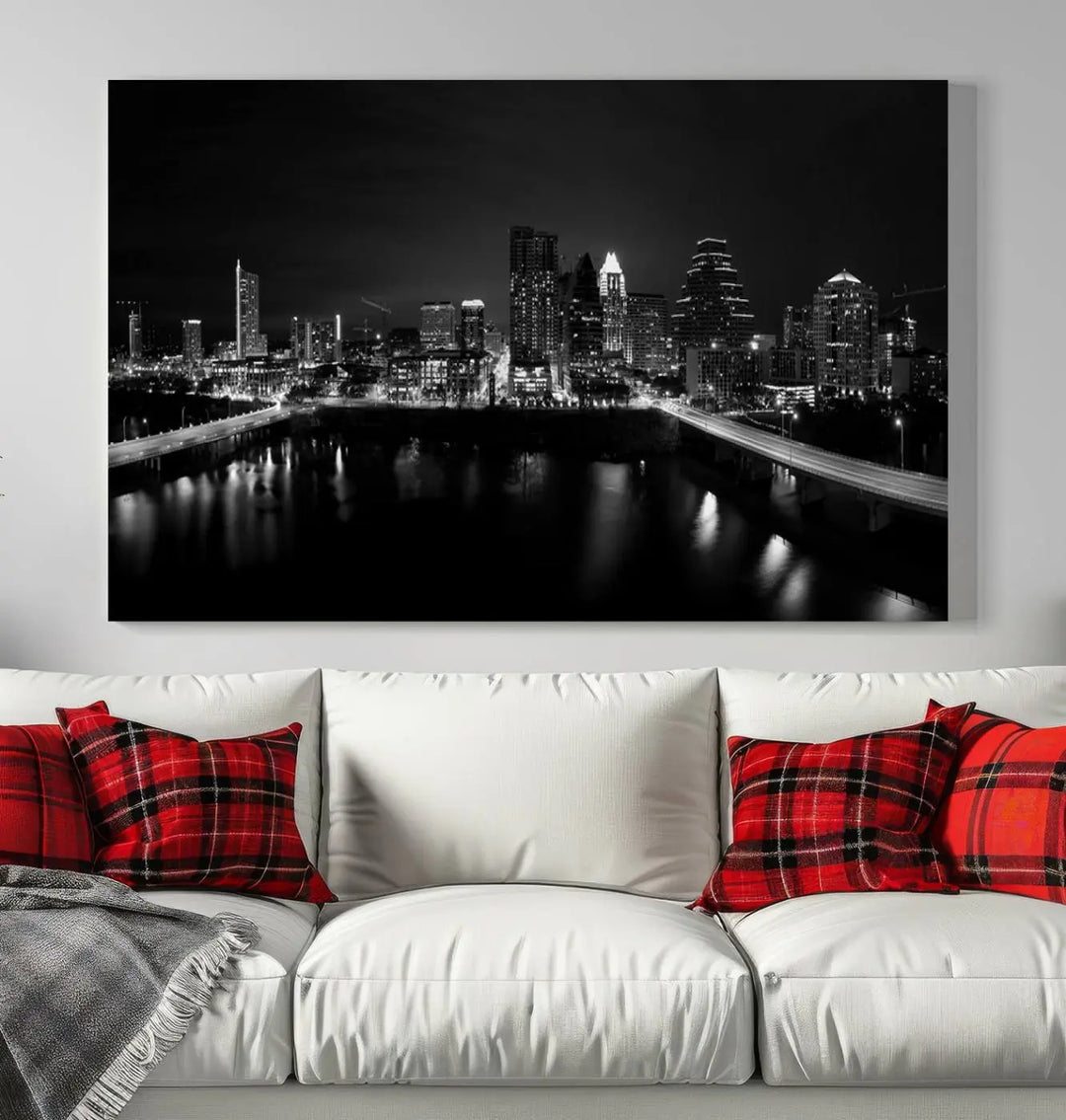 The Austin City Skyline Black and White Wall Art Cityscape Canvas Print, a stunning triptych of a nighttime cityscape printed on museum-quality canvases, adorns the wall. This hand-assembled framed artwork exudes elegance and features a UV-protective coating to maintain the city's captivating allure.