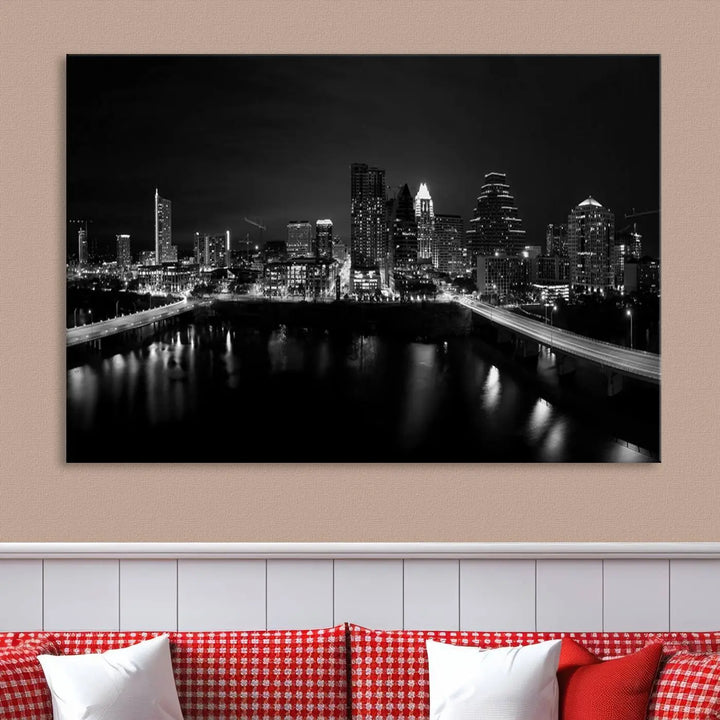 The Austin City Skyline Black and White Wall Art Cityscape Canvas Print, a stunning triptych of a nighttime cityscape printed on museum-quality canvases, adorns the wall. This hand-assembled framed artwork exudes elegance and features a UV-protective coating to maintain the city's captivating allure.