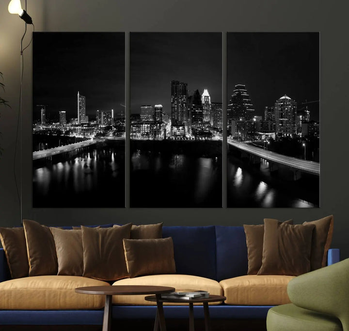 The Austin City Skyline Black and White Wall Art Cityscape Canvas Print, a stunning triptych of a nighttime cityscape printed on museum-quality canvases, adorns the wall. This hand-assembled framed artwork exudes elegance and features a UV-protective coating to maintain the city's captivating allure.