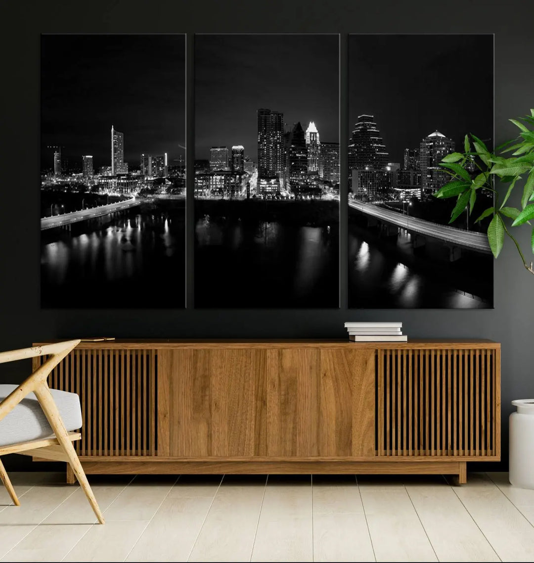 The Austin City Skyline Black and White Wall Art Cityscape Canvas Print, a stunning triptych of a nighttime cityscape printed on museum-quality canvases, adorns the wall. This hand-assembled framed artwork exudes elegance and features a UV-protective coating to maintain the city's captivating allure.