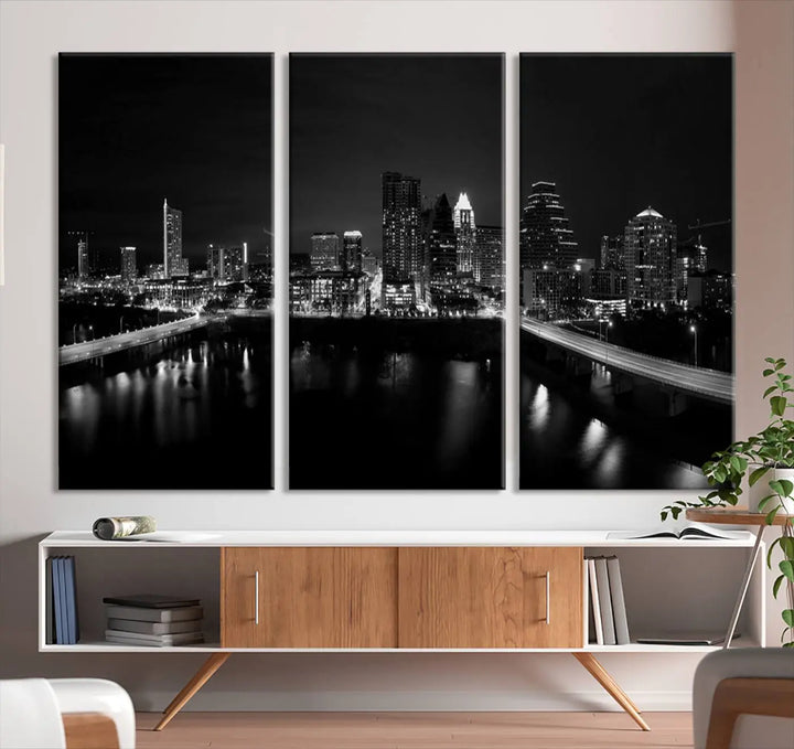 The Austin City Skyline Black and White Wall Art Cityscape Canvas Print, a stunning triptych of a nighttime cityscape printed on museum-quality canvases, adorns the wall. This hand-assembled framed artwork exudes elegance and features a UV-protective coating to maintain the city's captivating allure.