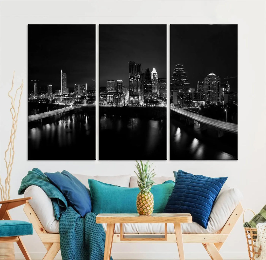 The Austin City Skyline Black and White Wall Art Cityscape Canvas Print, a stunning triptych of a nighttime cityscape printed on museum-quality canvases, adorns the wall. This hand-assembled framed artwork exudes elegance and features a UV-protective coating to maintain the city's captivating allure.