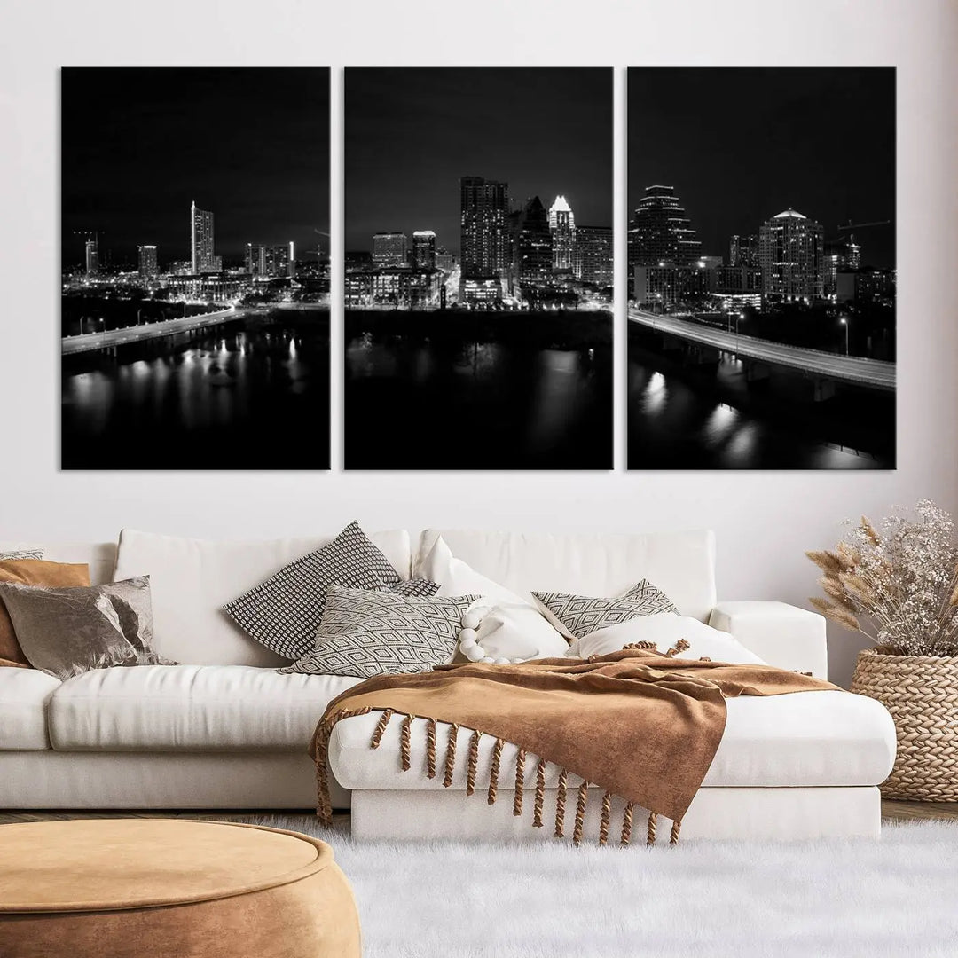 The Austin City Skyline Black and White Wall Art Cityscape Canvas Print, a stunning triptych of a nighttime cityscape printed on museum-quality canvases, adorns the wall. This hand-assembled framed artwork exudes elegance and features a UV-protective coating to maintain the city's captivating allure.