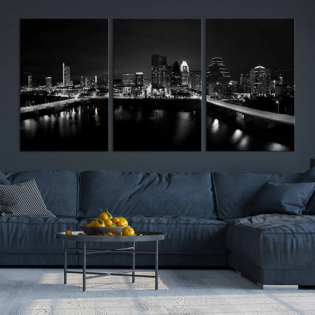 The Austin City Skyline Black and White Wall Art Cityscape Canvas Print, a stunning triptych of a nighttime cityscape printed on museum-quality canvases, adorns the wall. This hand-assembled framed artwork exudes elegance and features a UV-protective coating to maintain the city's captivating allure.