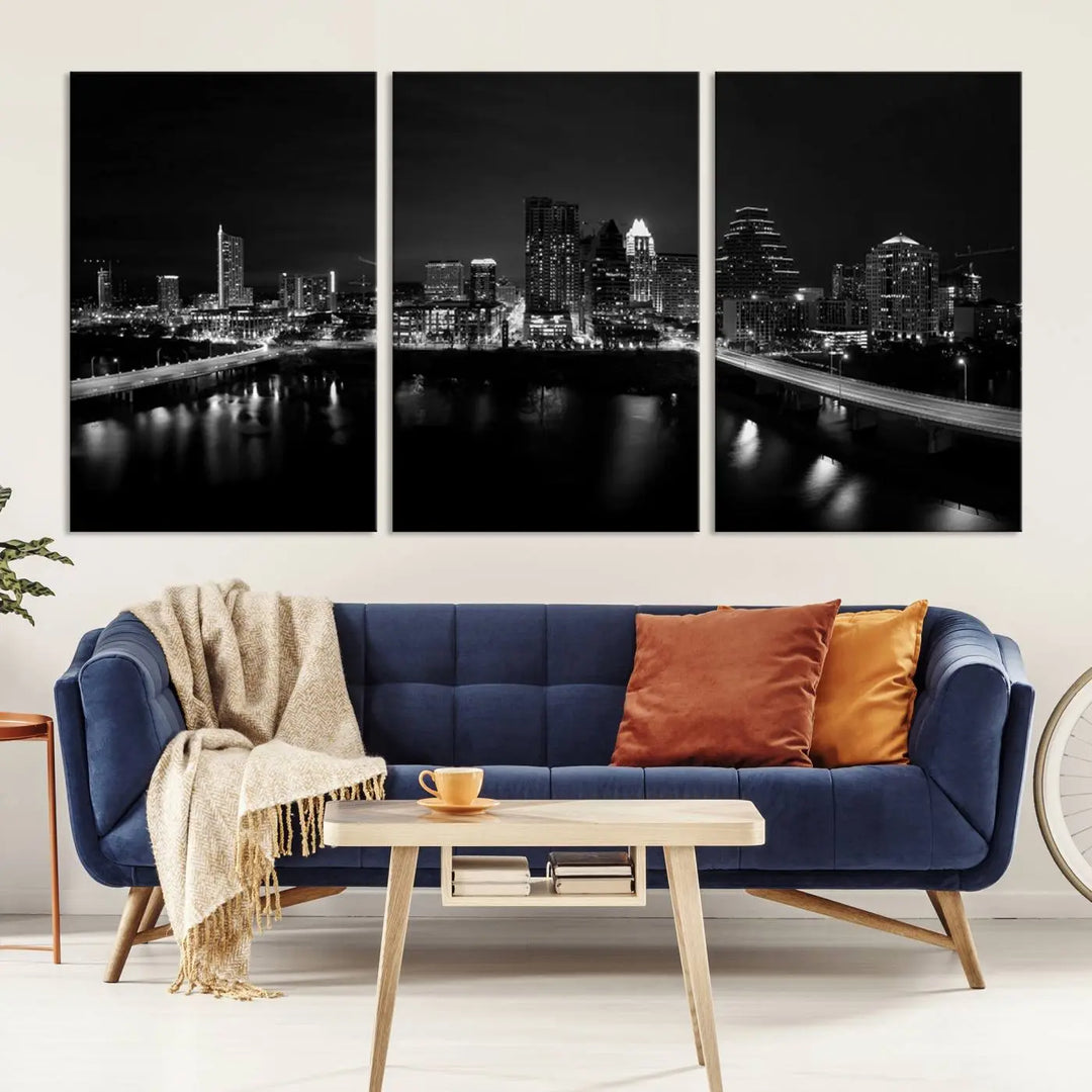 The Austin City Skyline Black and White Wall Art Cityscape Canvas Print, a stunning triptych of a nighttime cityscape printed on museum-quality canvases, adorns the wall. This hand-assembled framed artwork exudes elegance and features a UV-protective coating to maintain the city's captivating allure.