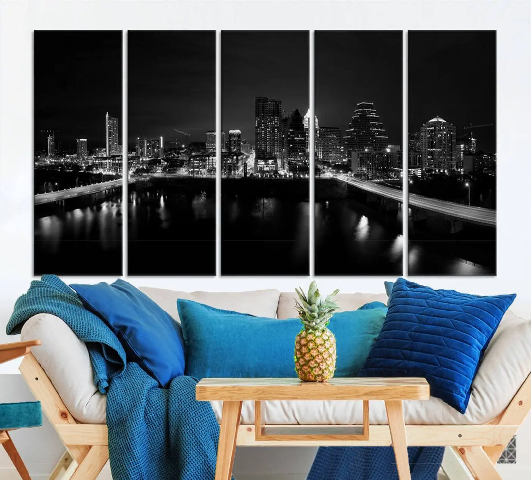 The Austin City Skyline Black and White Wall Art Cityscape Canvas Print, a stunning triptych of a nighttime cityscape printed on museum-quality canvases, adorns the wall. This hand-assembled framed artwork exudes elegance and features a UV-protective coating to maintain the city's captivating allure.