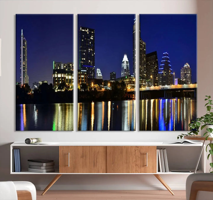 The Austin Lights Night Blue Skyline Cityscape View wall art canvas print features a city skyline and river on museum-quality canvas. It offers the perfect ready-to-hang solution that transforms any room into an urban oasis.