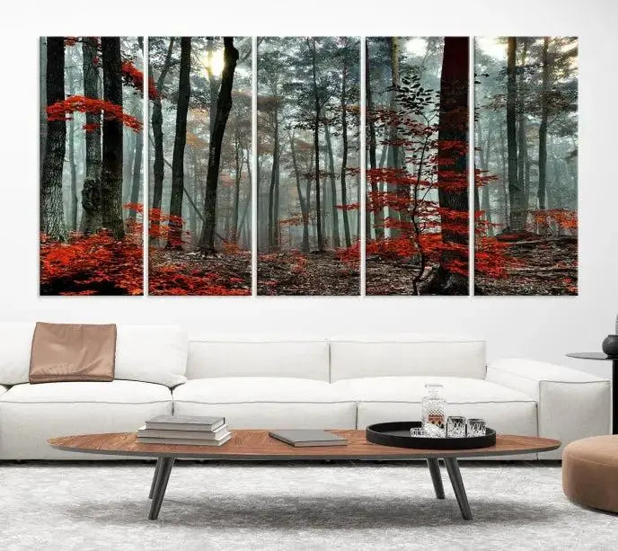 The Autumn Forest Canvas Wall Art showcases an enchanting triptych print of a foggy forest adorned with vibrant red leaves, offering nature-inspired wall art at its finest.