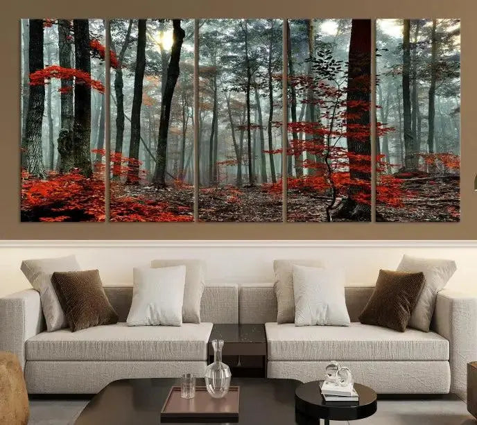 The Autumn Forest Canvas Wall Art showcases an enchanting triptych print of a foggy forest adorned with vibrant red leaves, offering nature-inspired wall art at its finest.
